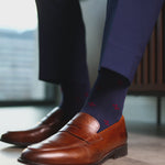 Navy blue men's sock with a garnet red flower pattern