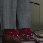 Merlot colored deep red socks with white t-sun pattern