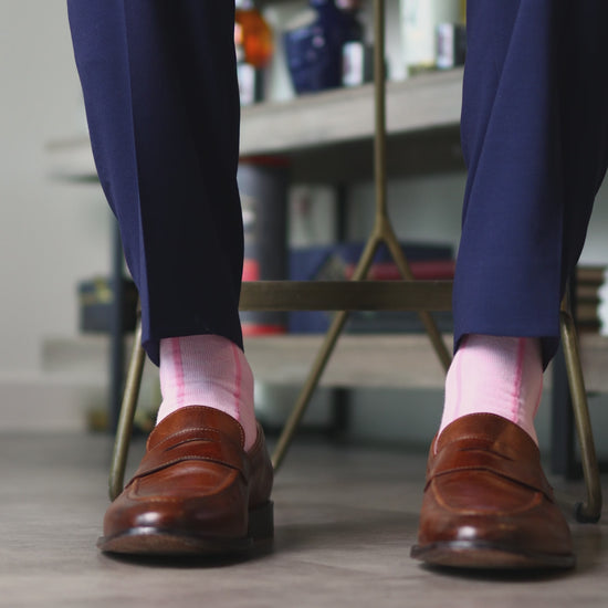 Blush pink men's dress socks with a bubblegum pink vertical stripe pattern