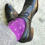 Man wearing purple dress socks with white hatches and dress shoes