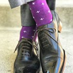 Man wearing purple dress socks with white hatches and dress shoes
