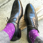 Man wearing purple dress socks with white hatches and dress shoes