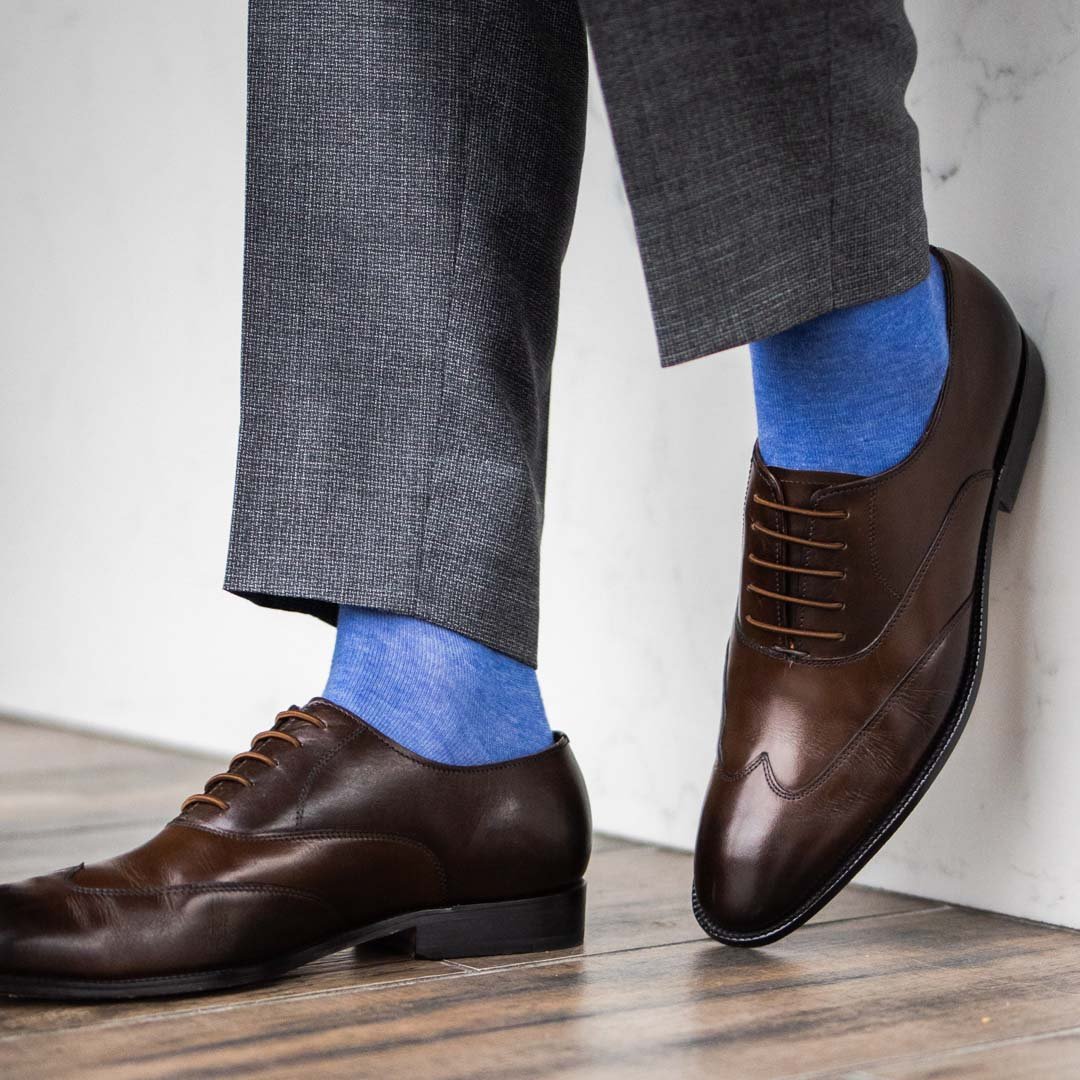 Man wearing steel blue men's dress socks.