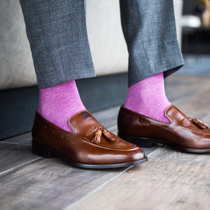 Man wearing fuchsia men's dress socks and brown shoes