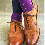 Man wearing purple dress socks with white hatches and brown dress shoes