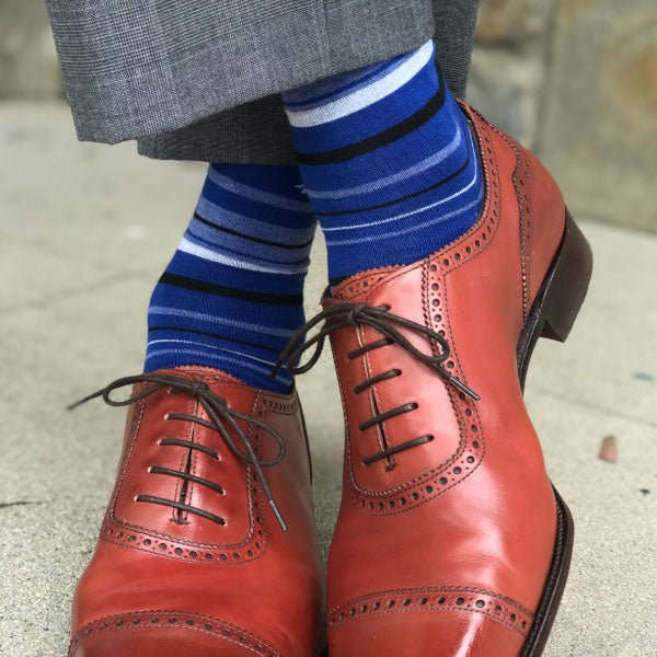 Blue striped socks with brown shoes