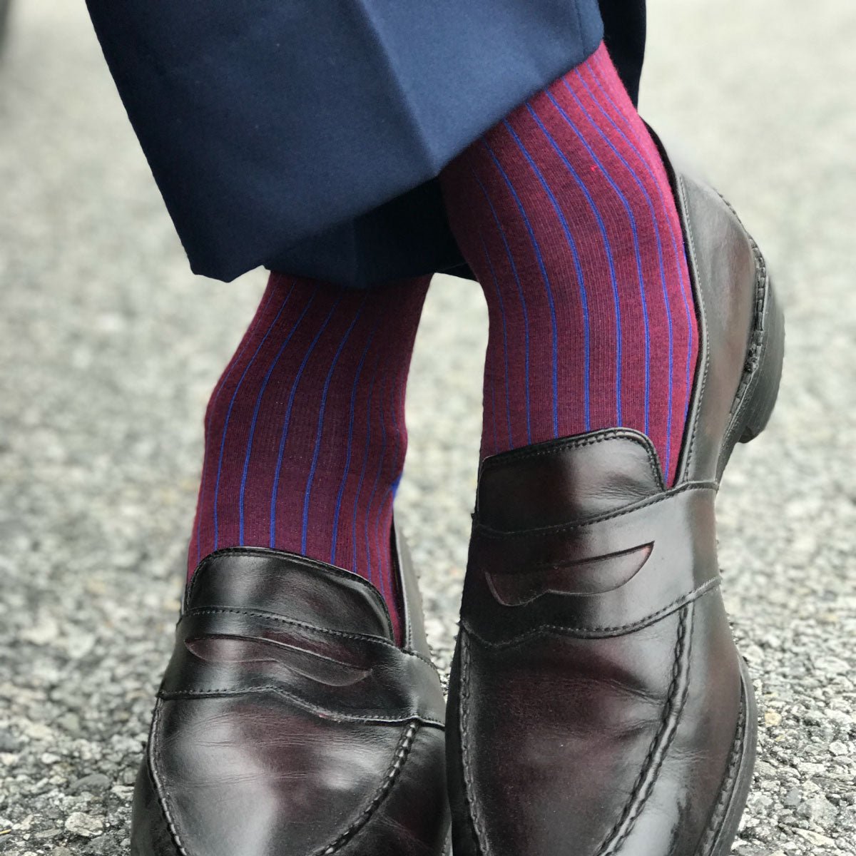 guy wearing blue and red pinstripe dress socks