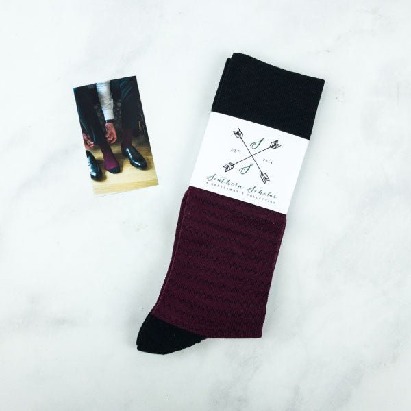 A pair of burgundy men's socks