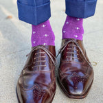 Man wearing purple dress socks with white hatches and brown dress shoes