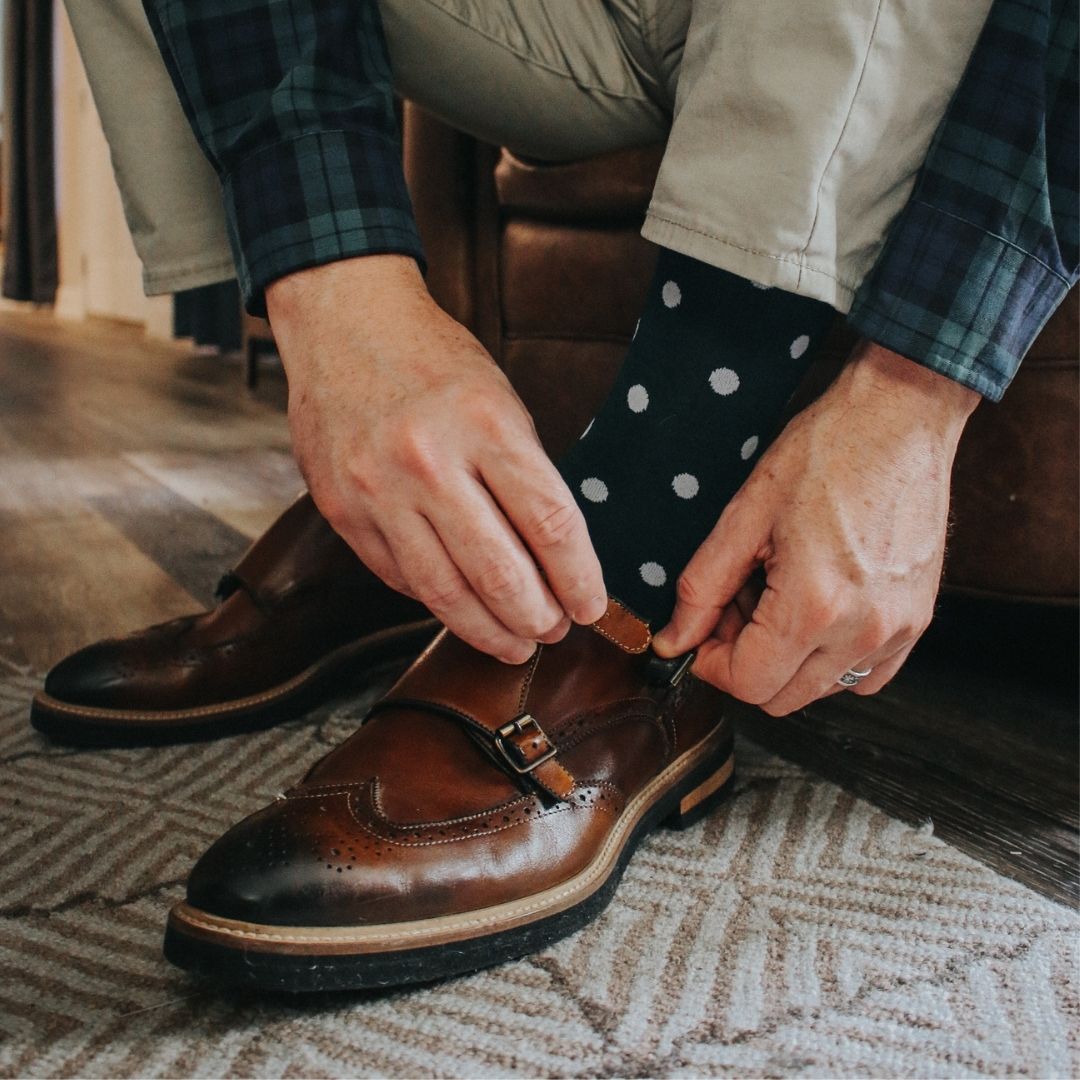 Man wearing green socks with white polka dots