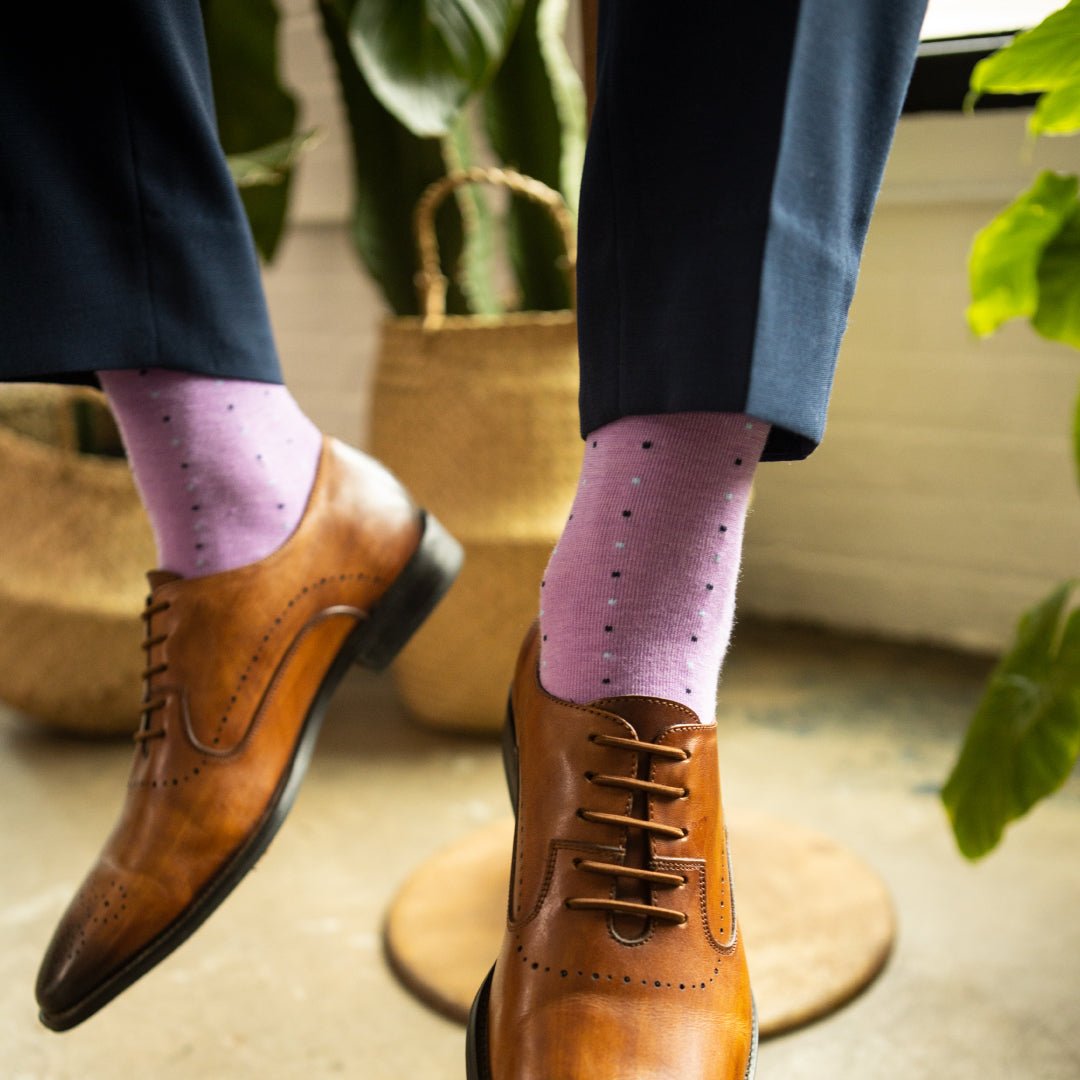 A purple periwinkle men's dress sock with navy and baby blue pin dots