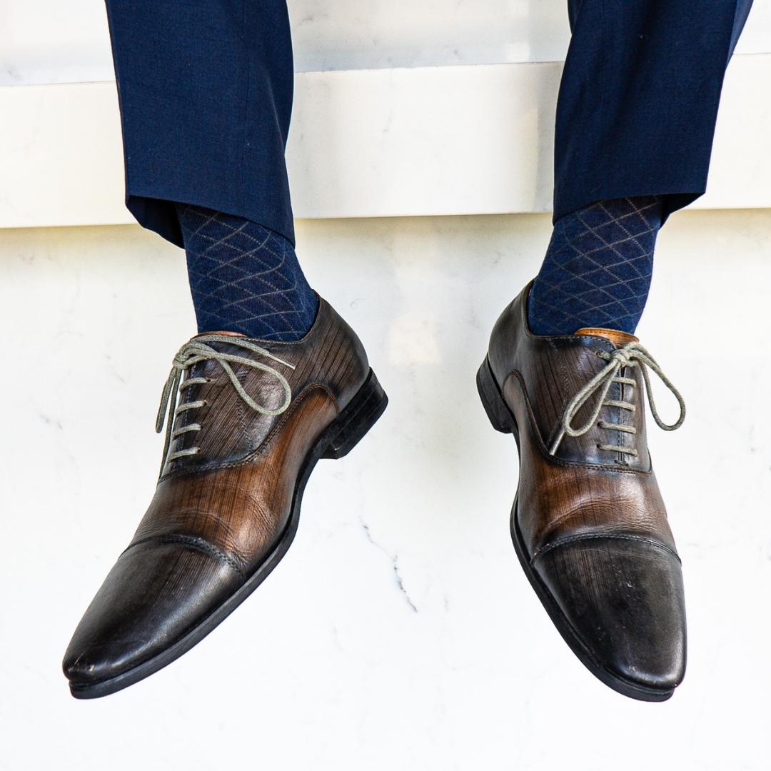 deep blue men's dress sock with contrasting diamond pattern