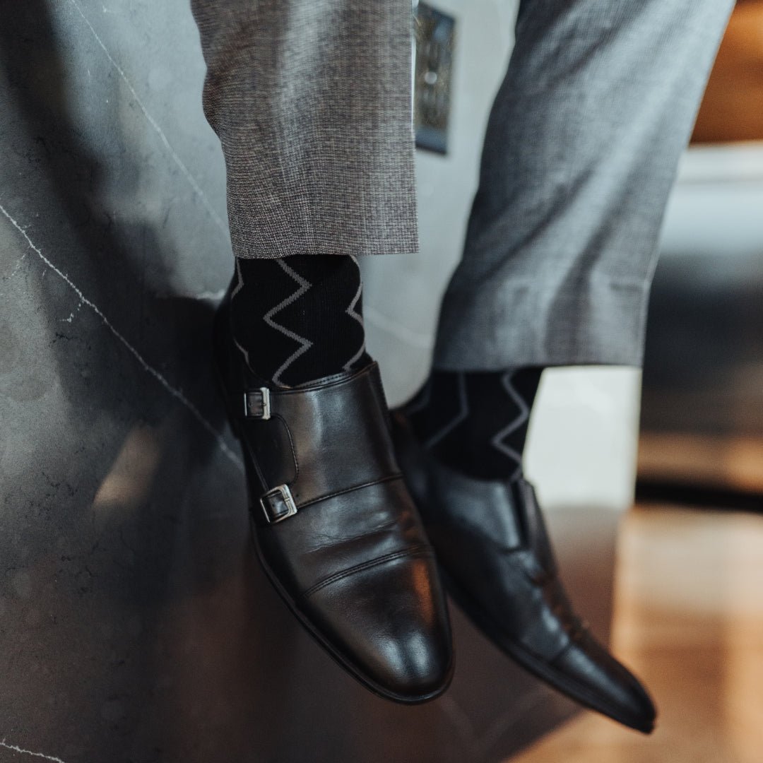 Black sock with silver vertical zigzag pattern