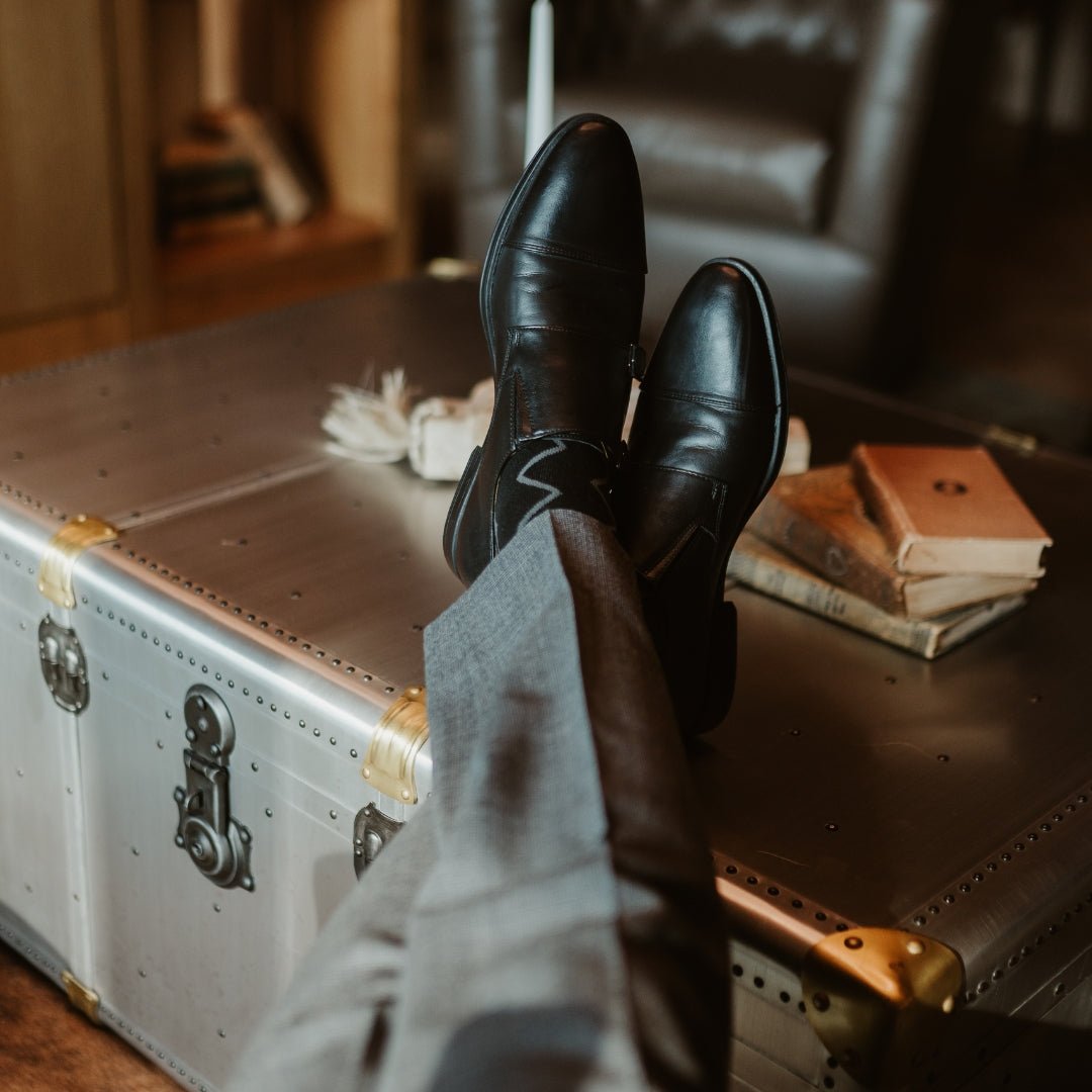 Black sock with vertical silver zigzag pattern