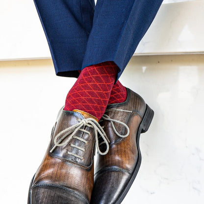 a deep red men's dress sock with a contrasting diamond pattern