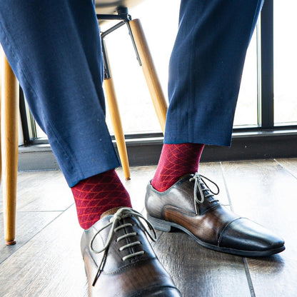 a deep red men's dress sock with a contrasting diamond pattern