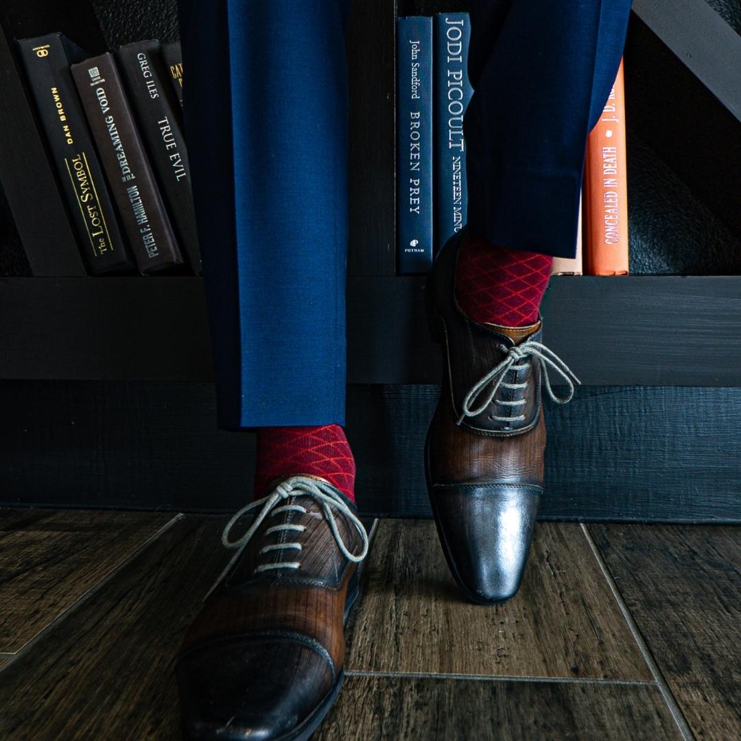 a deep red men's dress sock with a contrasting diamond pattern