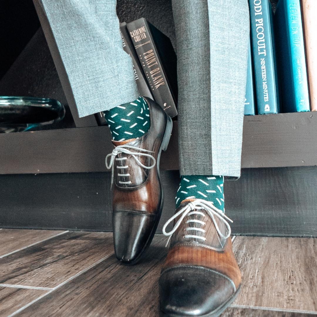 Hunter green men's dress sock with a contrasting sprinkle pattern