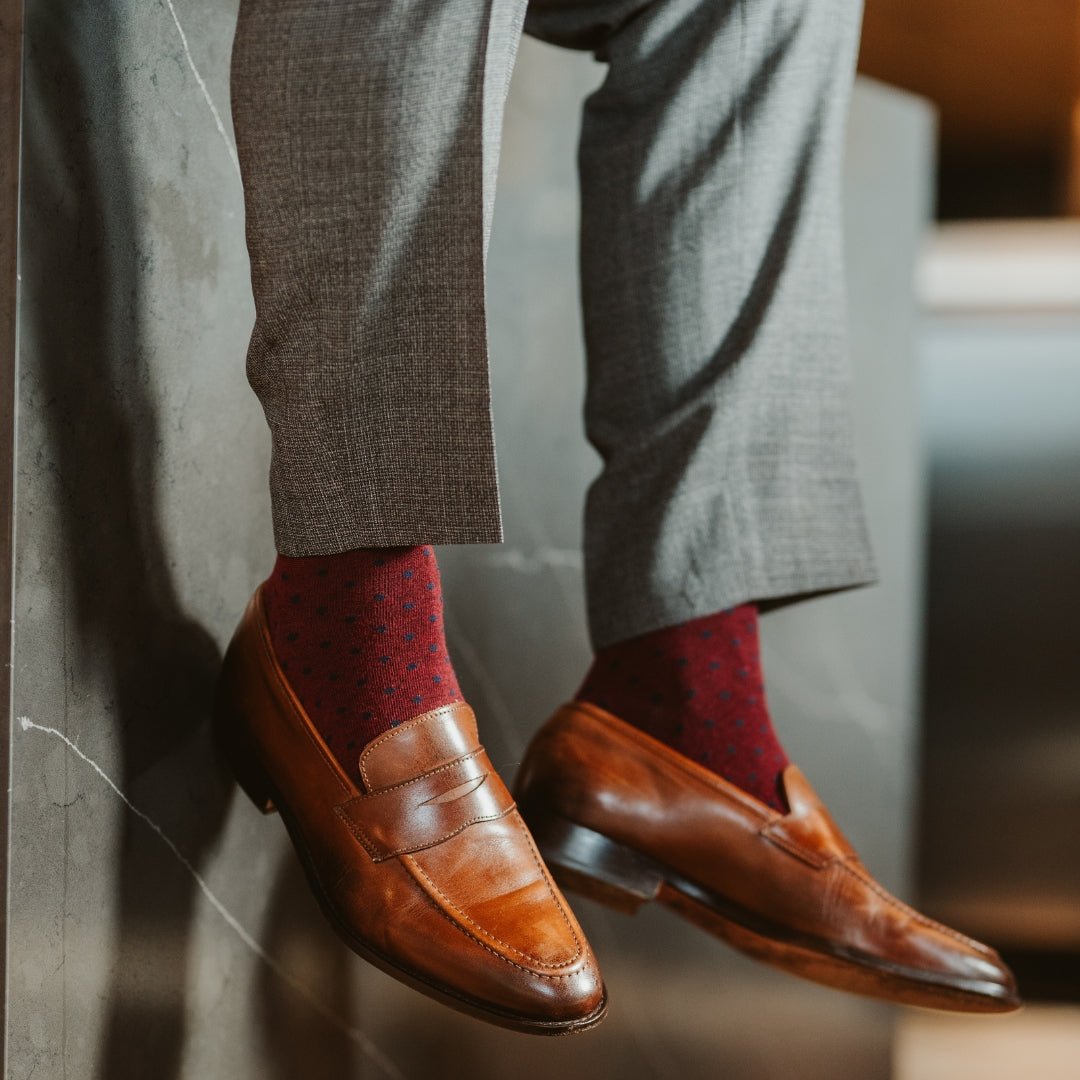 deep red men's dress sock with navy blue polkadots