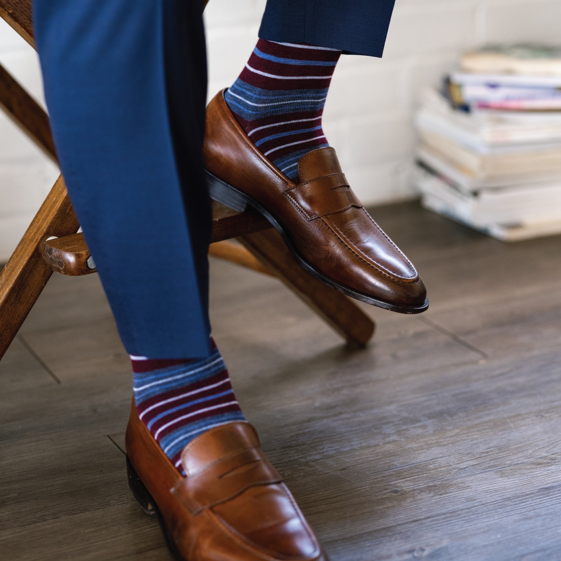 Deep red men's dress sock with blue and white stripes