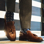 dark blue men's dress socks with light blue and white x pattern