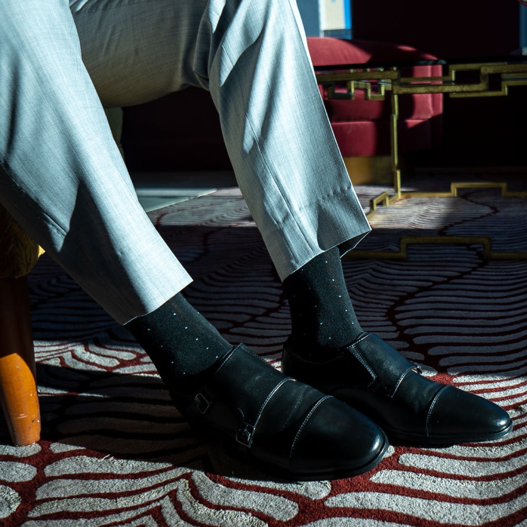 black men's dress sock with light blue pin dots