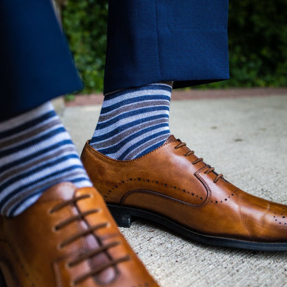 a guy wearing grey, blue, and white striped men's dress sock