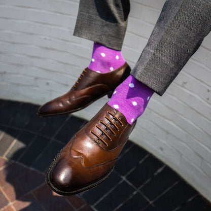guy wearing lilac purple sock with white polka dots