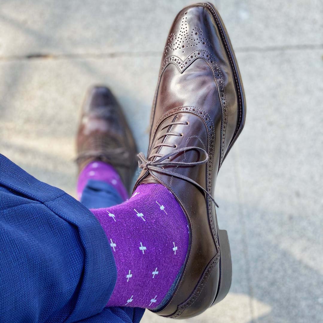 Man wearing purple dress socks and brown dress shoes