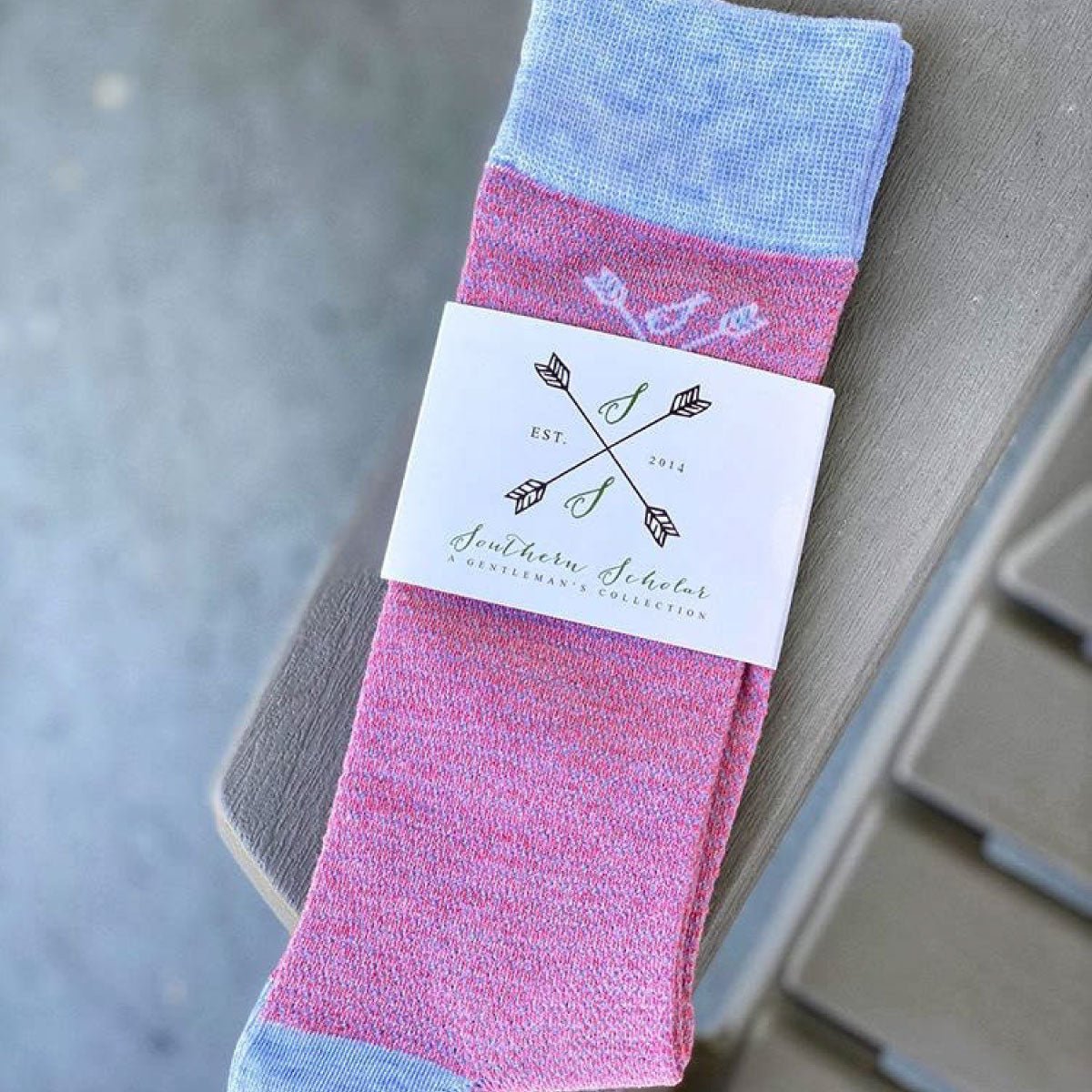 A pair of pink and blue textured men's dress socks