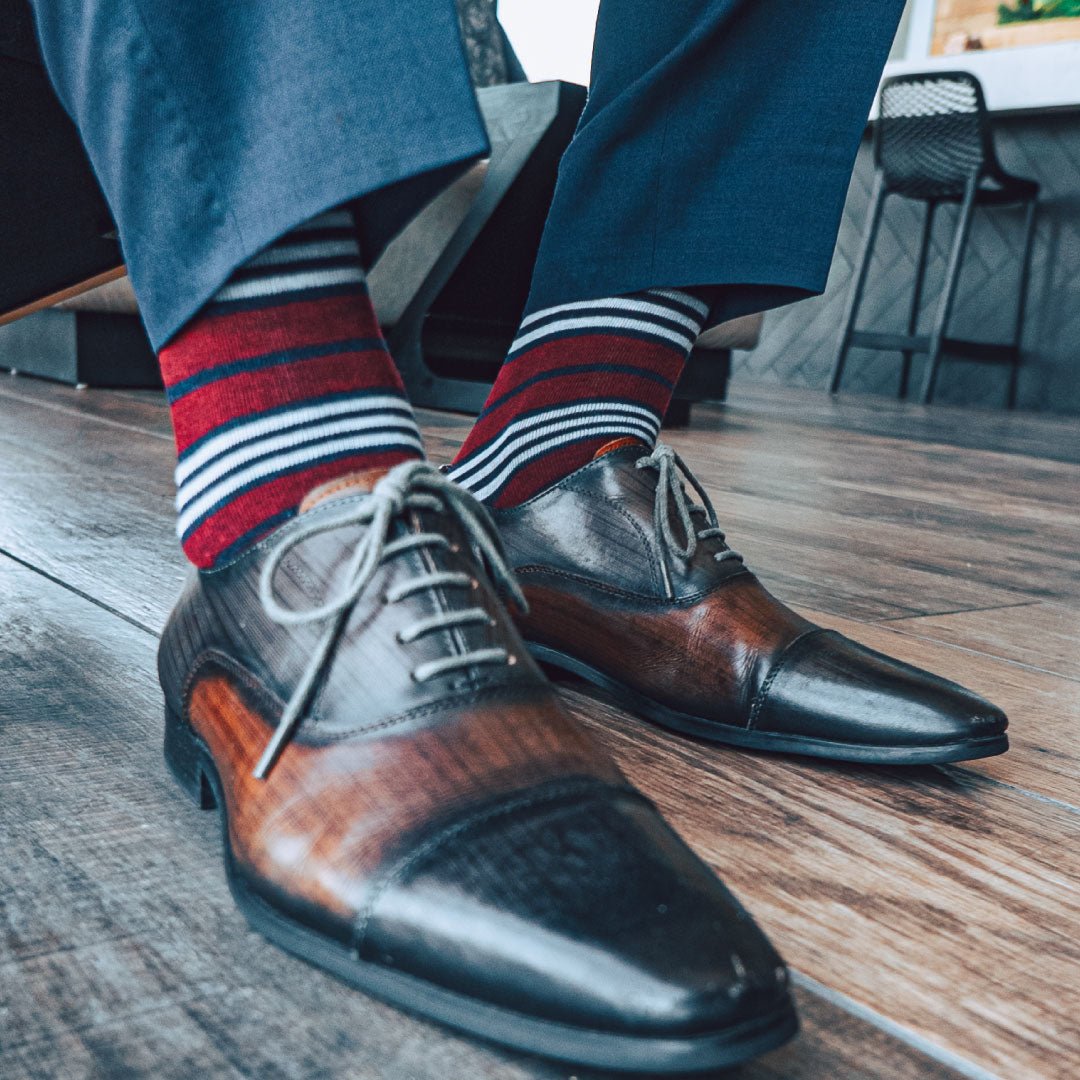 red, white, and blue multi-stripe patterned men's dress socks