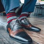red, white, and blue multi-stripe patterned men's dress socks