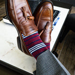red, white, and blue multi-stripe patterned men's dress socks